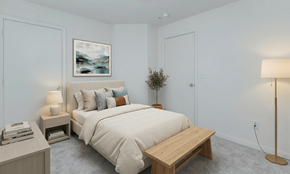 North Chesterfield apartment for rent - A bedroom with a bed, nightstands, and a painting on the wall.