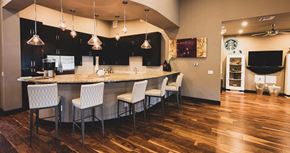 San Antonio apartment for rent - a kitchen and dining room with a bar and chairs