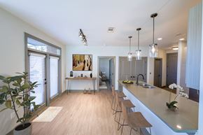 Duluth apartment for rent - A kitchen with a long counter and bar stools.