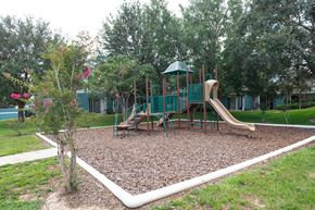 Avon Park apartment for rent - a playground with a slide and swings