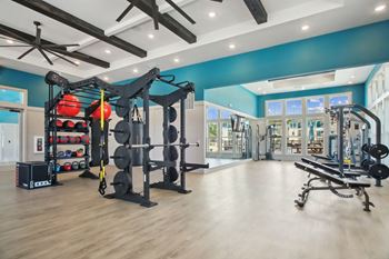 Expansive 24-hour fitness center with yoga space