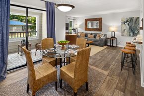 Sandy Springs apartment for rent - A dining room with a glass table surrounded by chairs.
