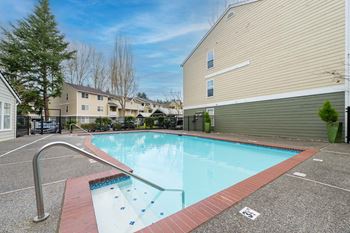 Seasonally heated outdoor shimmering swimming pool and sundeck