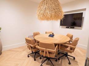 Atlanta apartment for rent - A conference room with a round table and chairs.