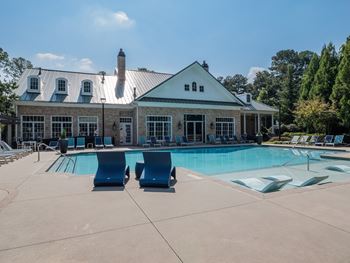 Resort-style saltwater swimming pool with a sunning ledge