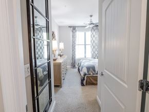 Atlanta apartment for rent - A bedroom with two beds and a ceiling fan.