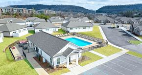 Ooltewah apartment for rent - a house with a swimming pool in front of some houses