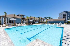 Beaufort apartment for rent - A large swimming pool with lane markers and a building in the background.