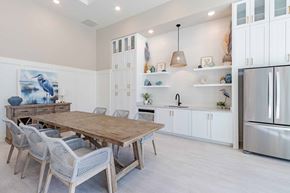 Beaufort apartment for rent - A modern dining room with a wooden table and chairs.