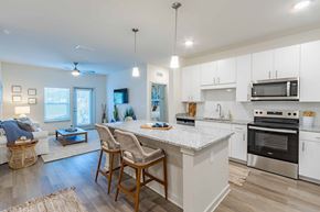 Beaufort apartment for rent - A modern kitchen with white cabinets and stainless steel appliances.