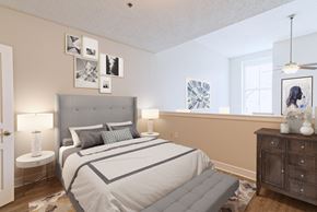 Memphis apartment for rent - A bedroom with a large bed and a dresser.