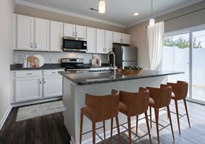 Chattanooga apartment for rent - a kitchen with white cabinets and a counter top