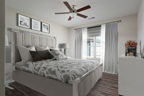Chattanooga apartment for rent - a bedroom with a bed and a ceiling fan
