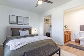 Benton apartment for rent - a bedroom with a bed and a bathroom with a toilet