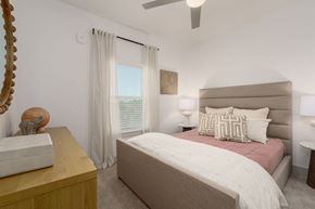 Santa Rosa Beach apartment for rent - A bedroom with a large bed and a wooden dresser.