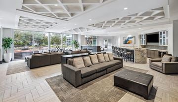 Atlanta apartment for rent - A spacious living room with a large sectional sofa and a coffee table.
