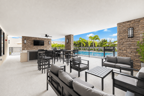 Goulds apartment for rent - A patio with a pool and furniture.