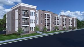 Nashville apartment for rent - Luxury Apartments in Nashville, TN with In-Unit Washer and Dryer - Crest at Stones Branch - Street View of Property Highlighting Concrete Pathway, Manicured Front Lawn, Private Patios and Balconies, and Wooded Area.