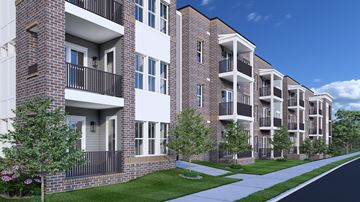 Nashville apartment for rent - A row of modern apartment buildings with balconies and windows.