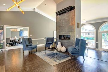 Riverdale apartment for rent - a living room with a fireplace and chairs