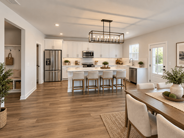 Gainesville apartment for rent - A modern kitchen with a dining table and chairs.