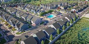 Gainesville apartment for rent - an aerial view of a neighborhood of houses with a swimming pool