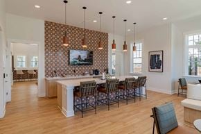 Gainesville apartment for rent - A kitchen with a dining table and chairs.