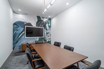 Co-working lounge w/ private rooms & conference room