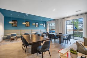 Chattanooga apartment for rent - A modern dining room with a long table and chairs.