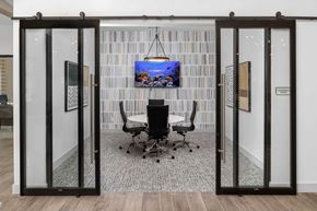 Acworth apartment for rent - a conference room with a table and a tv on the wall