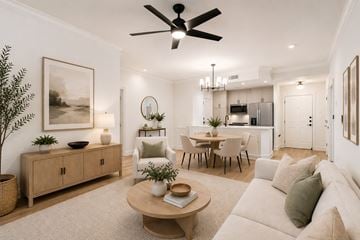 Atlanta apartment for rent - A living room with a white couch and a wooden coffee table.