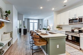Summerville apartment for rent - A kitchen with a table and chairs in the middle of the room.