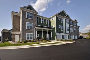 Wyoming apartment for rent - Apartment building with a parking lot in front.