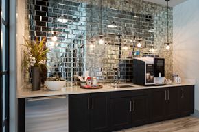 Memphis apartment for rent - a kitchen with black cabinets and a counter with a sink and a microwave