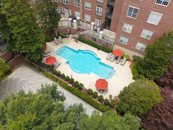 Two resort-style pools with lounge seating