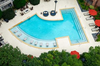 Two resort-style pools with lounge seating