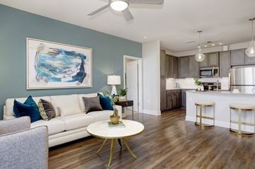 Antioch apartment for rent - A living room with a white couch and a painting on the wall.