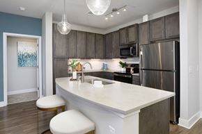 Antioch apartment for rent - A kitchen with a white counter top and a refrigerator.