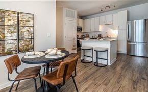 Brunswick apartment for rent - Apartments For Rent In Brunswick, ga - Vintage Brunswick - Open Concept Kitchen And Dining Area With White Cabinets, Quartz Island Seating, Stainless Steel Appliances, And Wood Style Floors.