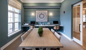 Brunswick apartment for rent - A conference room with a long table and chairs.