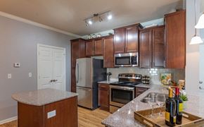 Gallatin apartment for rent - a kitchen with stainless steel appliances and granite counter tops