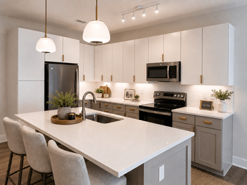 Murfreesboro apartment for rent - A modern kitchen with a white countertop and grey cabinets.