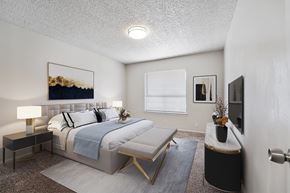 Odessa apartment for rent - A bedroom with a large bed and a painting on the wall.