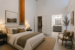 Warrenville apartment for rent - A bedroom with a large bed and a chair.