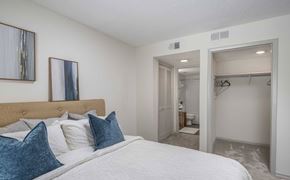 Columbia apartment for rent - A bedroom with a large bed and a closet.