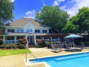 Atlanta apartment for rent - A house with a pool in front of it.