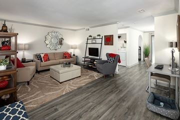 Atlanta apartment for rent - A living room with a grey couch and a white coffee table.