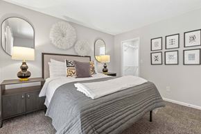 Norcross apartment for rent - A bedroom with a large bed and two lamps.