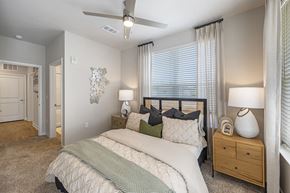 Powder Springs apartment for rent - a bedroom with a bed and a ceiling fan
