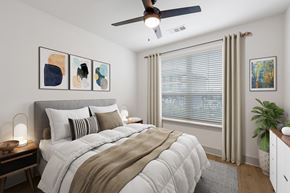 Huntsville apartment for rent - One-Bedroom Luxury Apartments in Huntsville, AL - The Kelvin - Bedroom with Luxury Vinyl Tile Flooring, Area Rug, Bed, Nightstands with Lamps, Dresser, Ceiling Fan, Potted Plant, and Spacious Window.